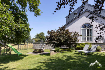 Maison de vacances à Gouvy pour 9 personnes et 1 chien avec piscine, sauna, pétanque et jeux extérieurs